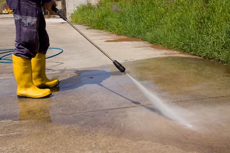 Pressure washing for surface stain removal